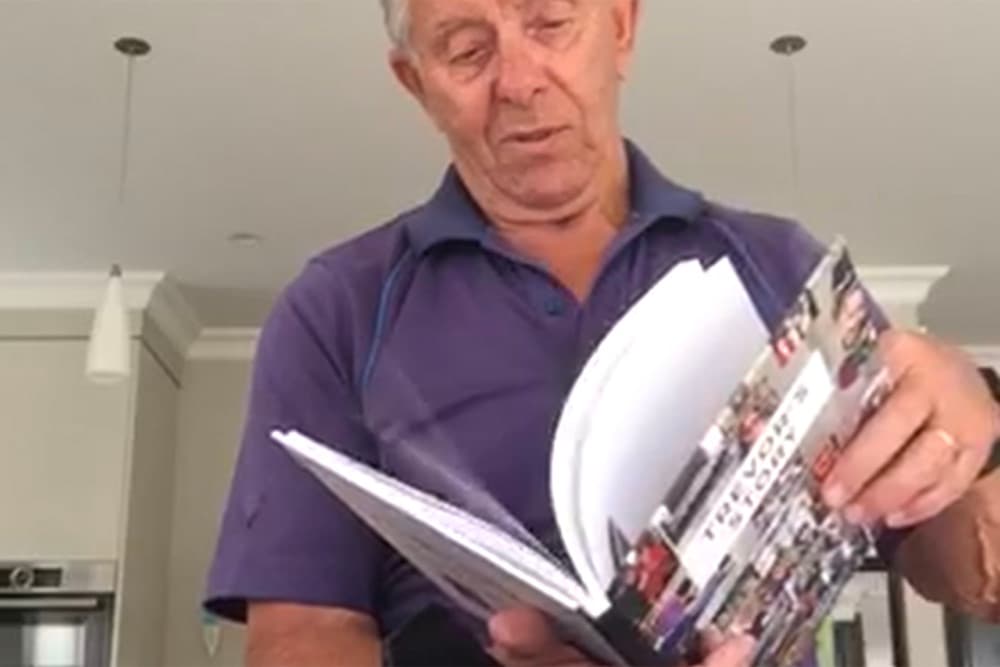 Trevor holding his finished My Stories Matter book